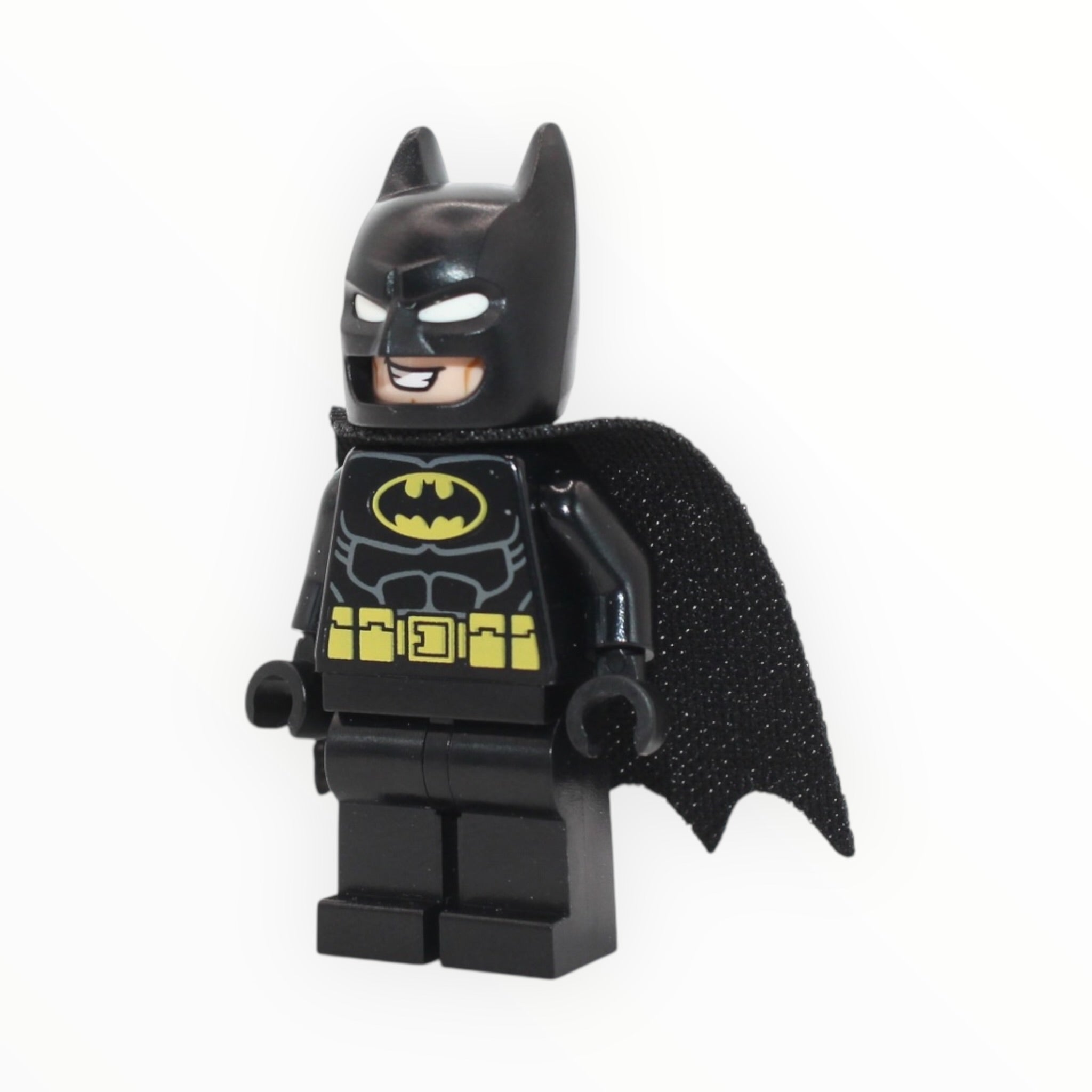 Batman (molded white eyes, black suit, large grin, one-hole cape, 2023)