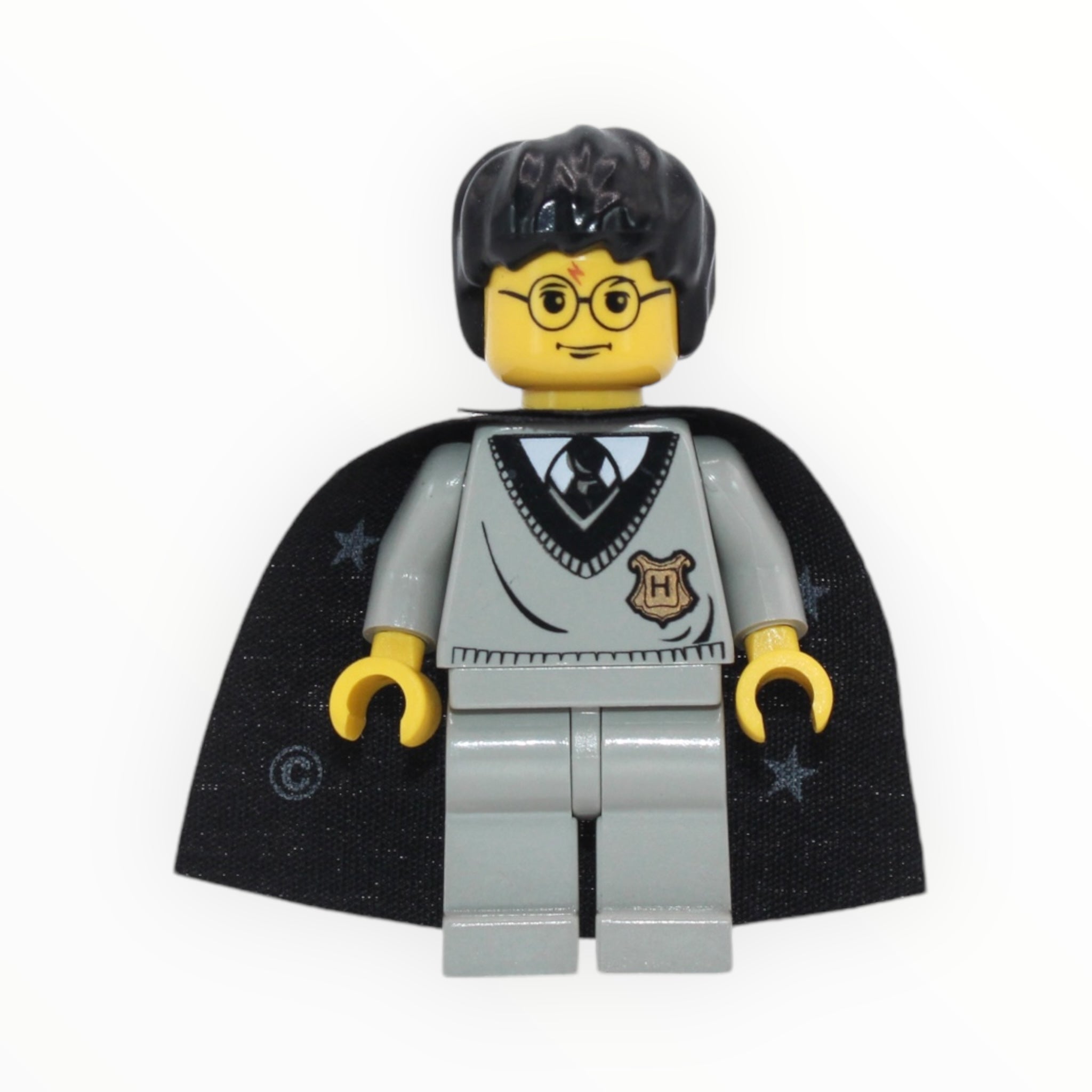 Harry Potter (Hogwarts sweater, star cape, yellow skin, black hair)