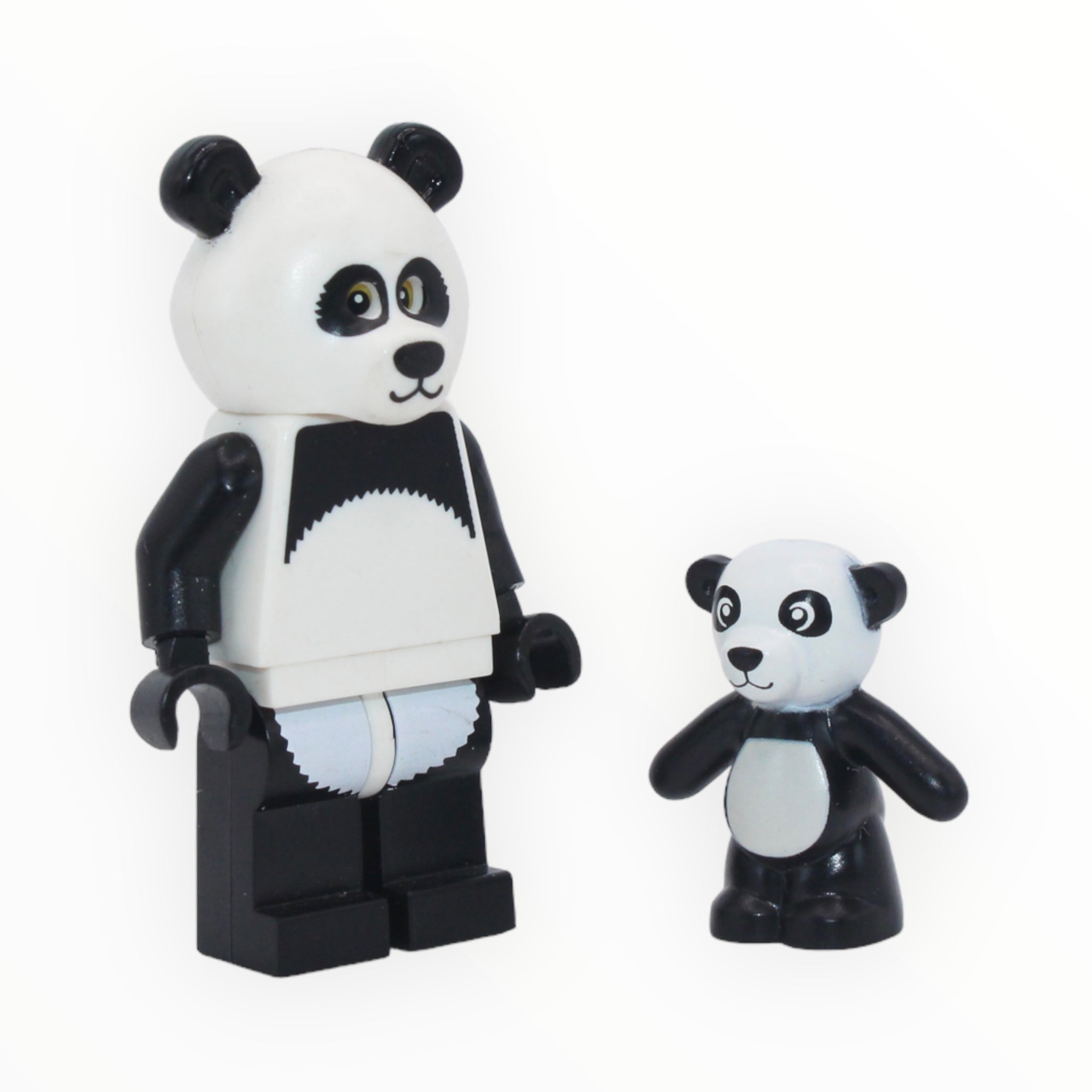 two stuffed animals are sitting on a table