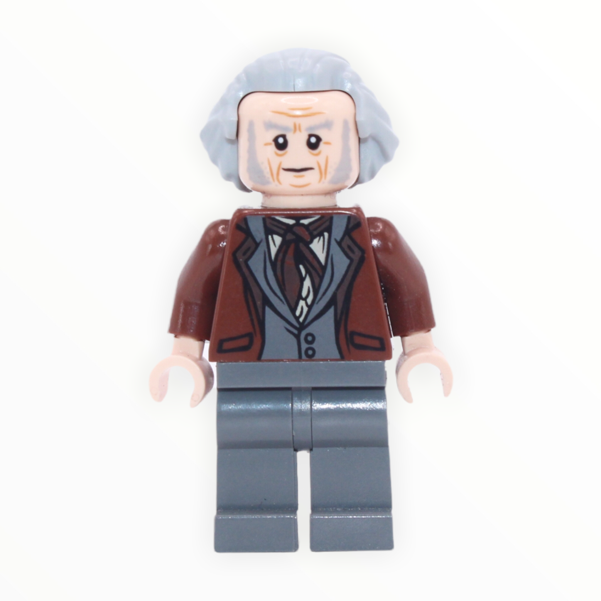 Garrick Ollivander (reddish brown jacket, hair swept back, 2018)