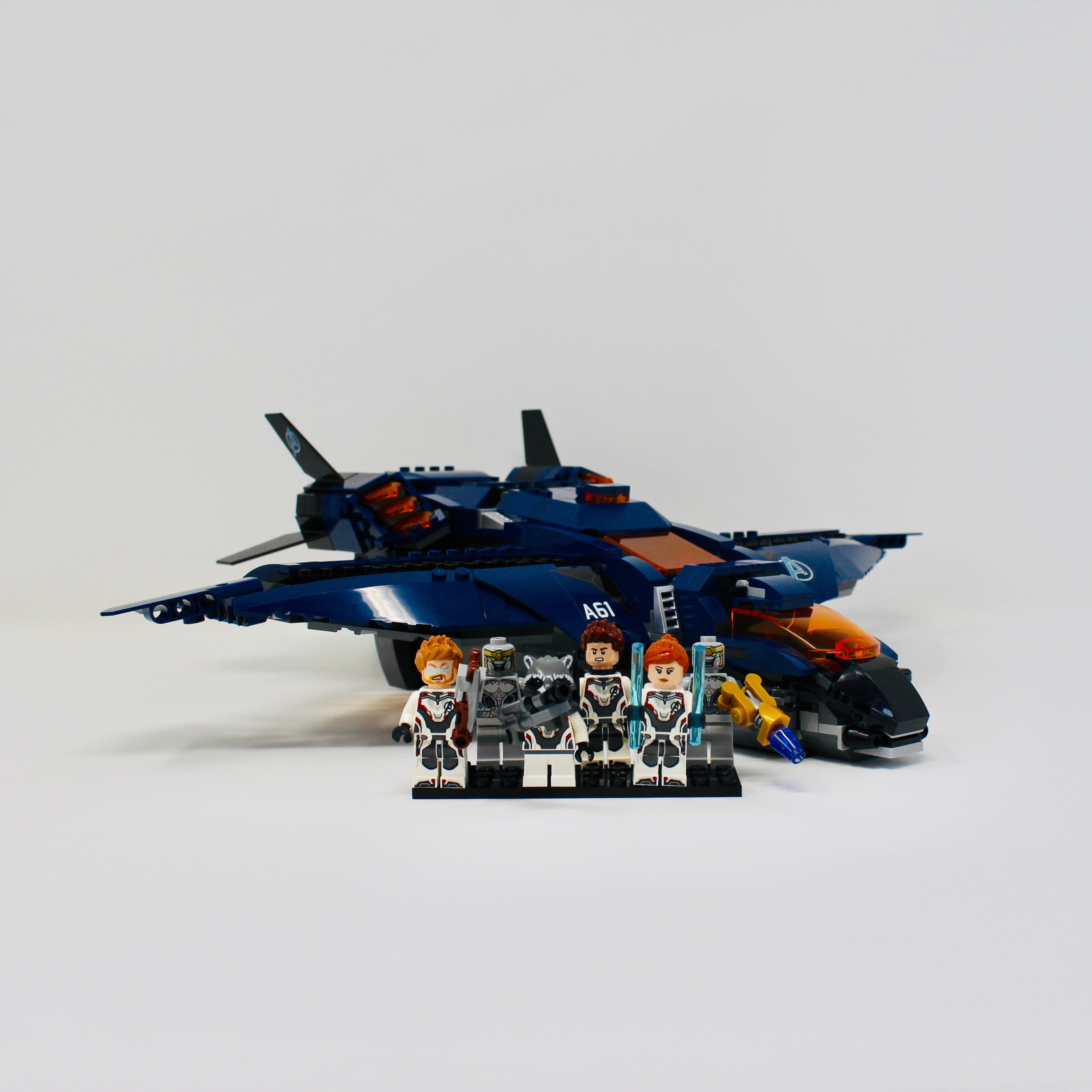 a fighter jet sitting on top of a snow covered ground