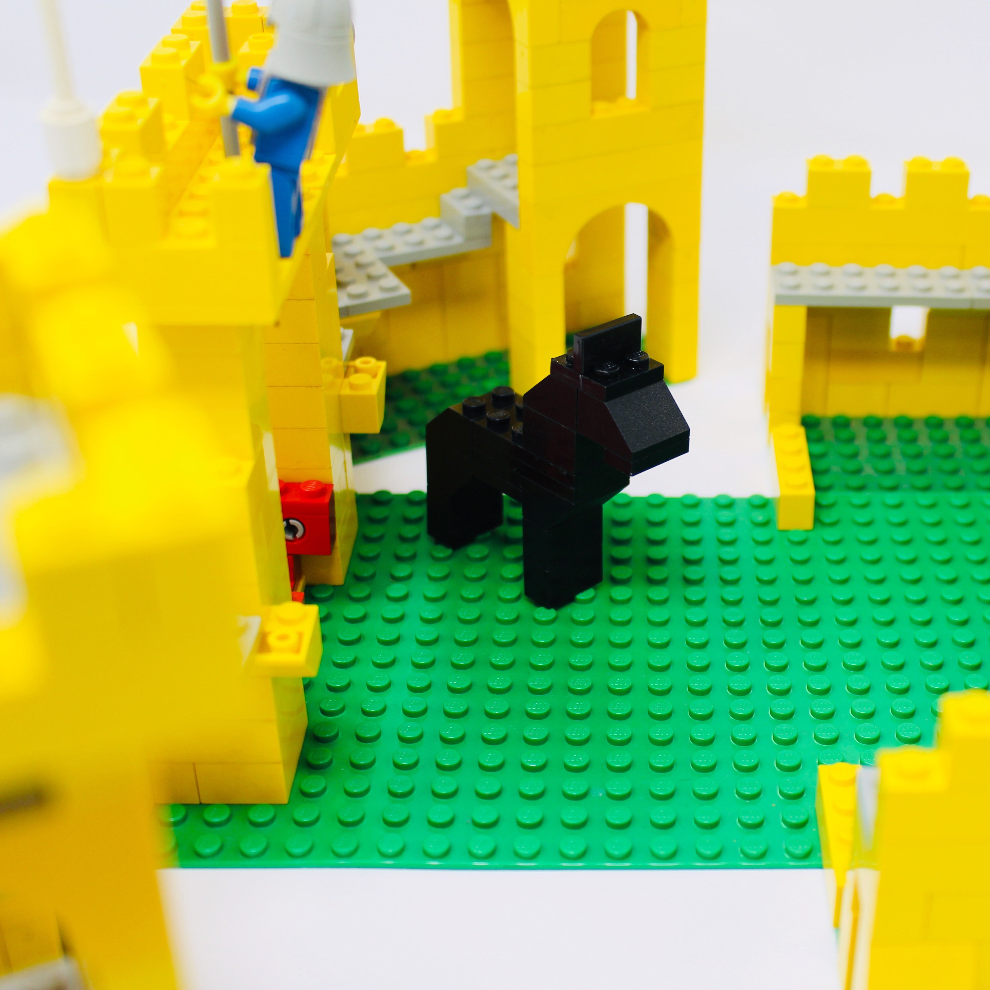 a yellow fire hydrant sitting in front of a yellow fire hydrant