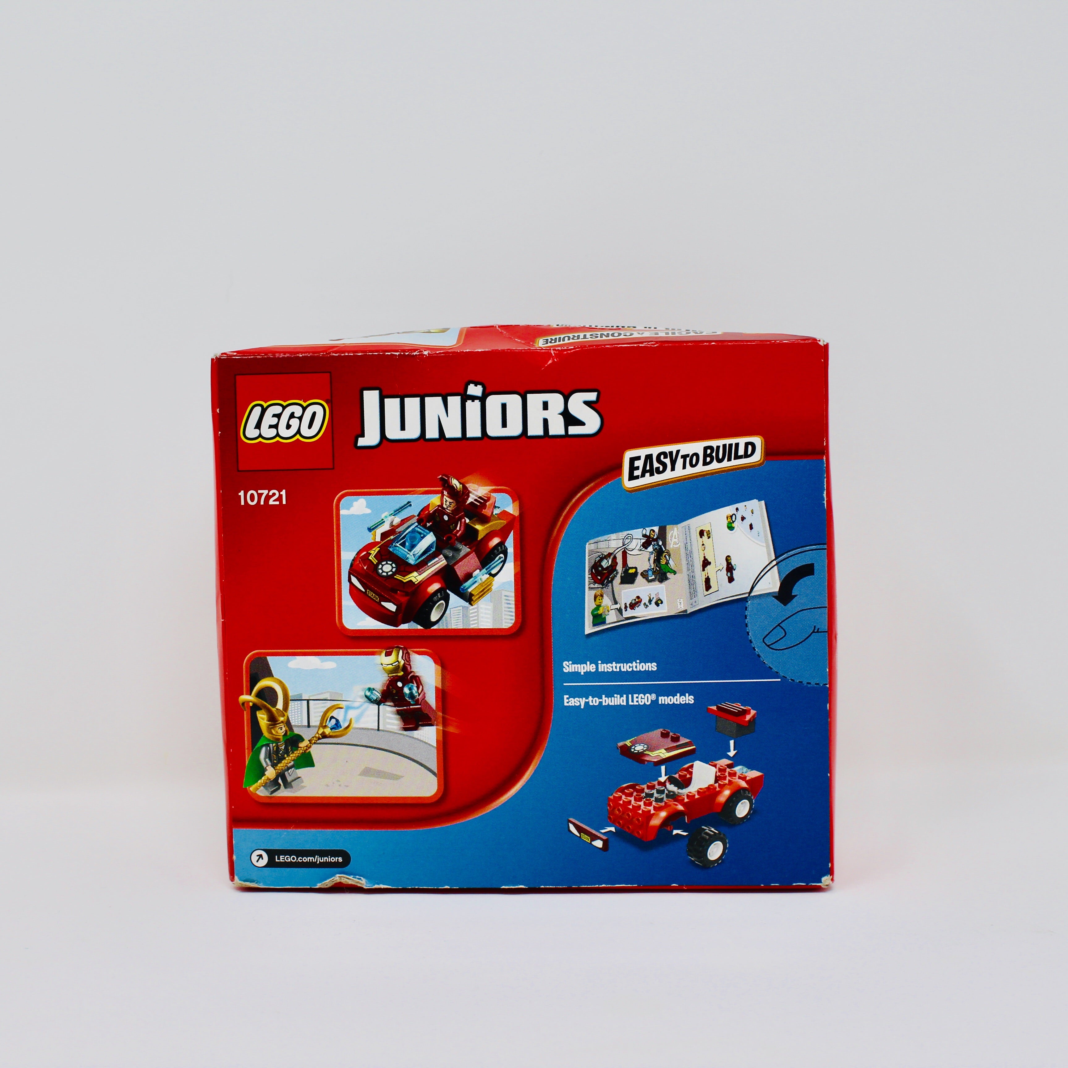 a coca cola sign on a white wall