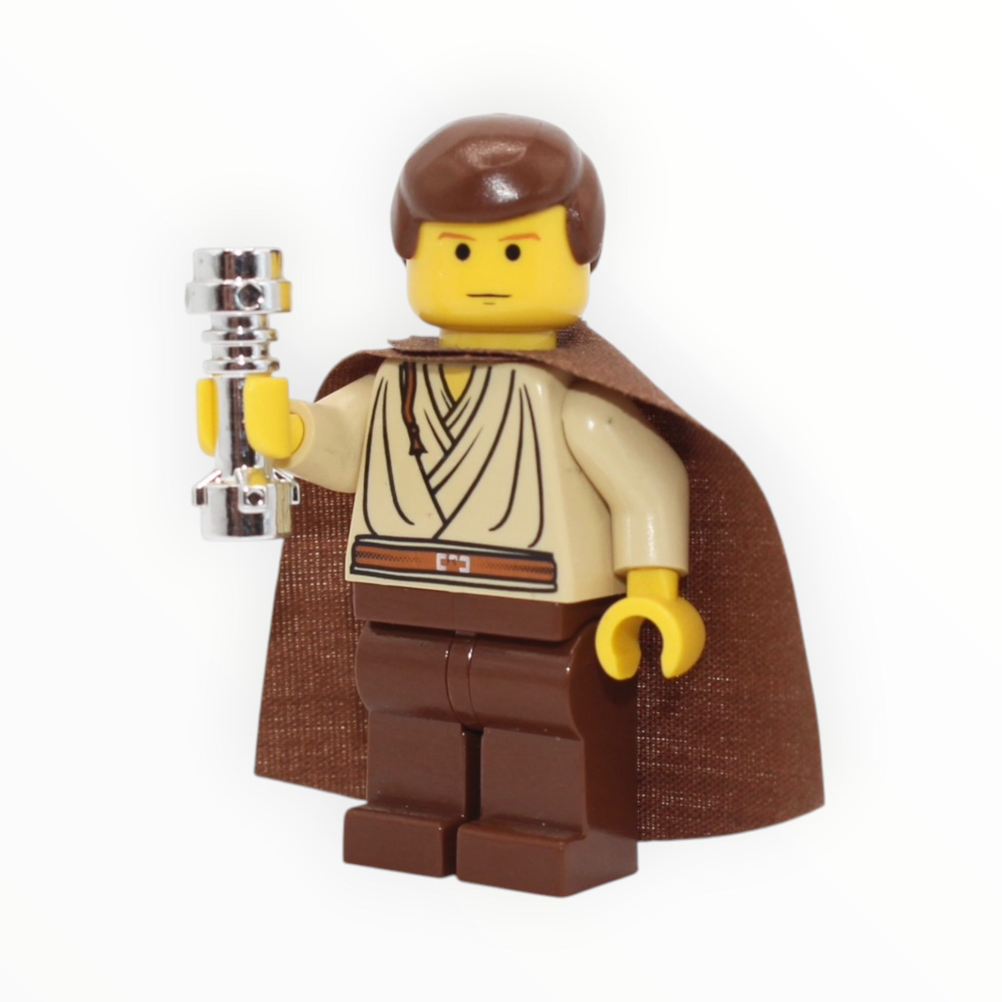 Obi-Wan Kenobi (Padawan, yellow skin, old brown hair and cape, chrome hilt, 2002)