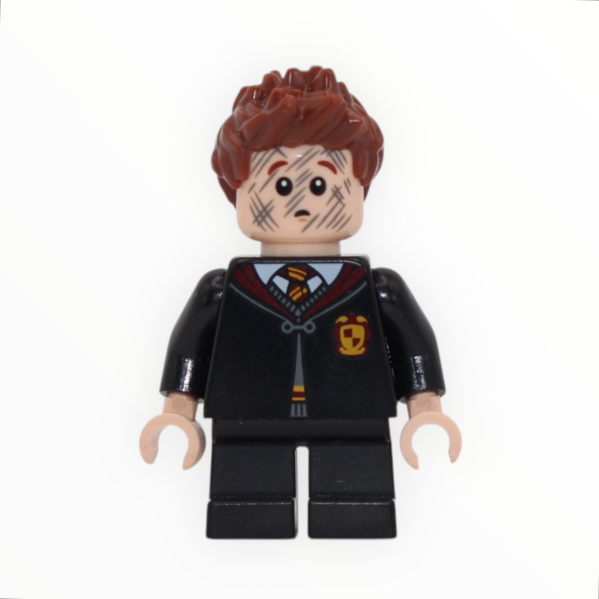 Seamus Finnigan (Gryffindor clasped robe, dirty face, short legs)