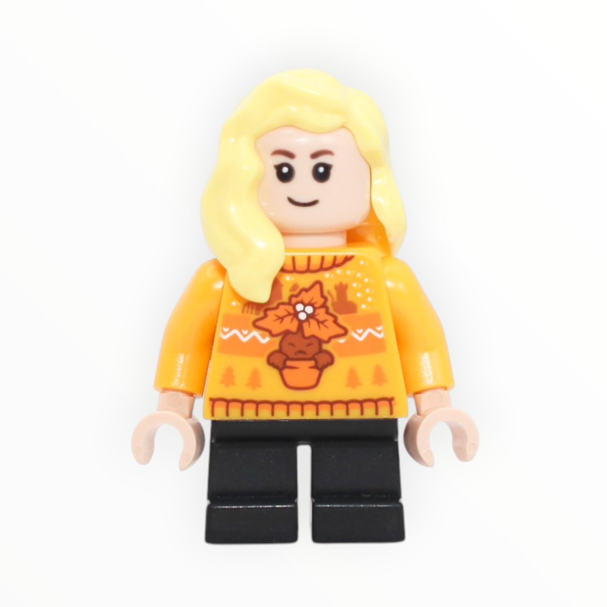 Hannah Abbott (bright light orange holiday sweater, short black legs, 2025)