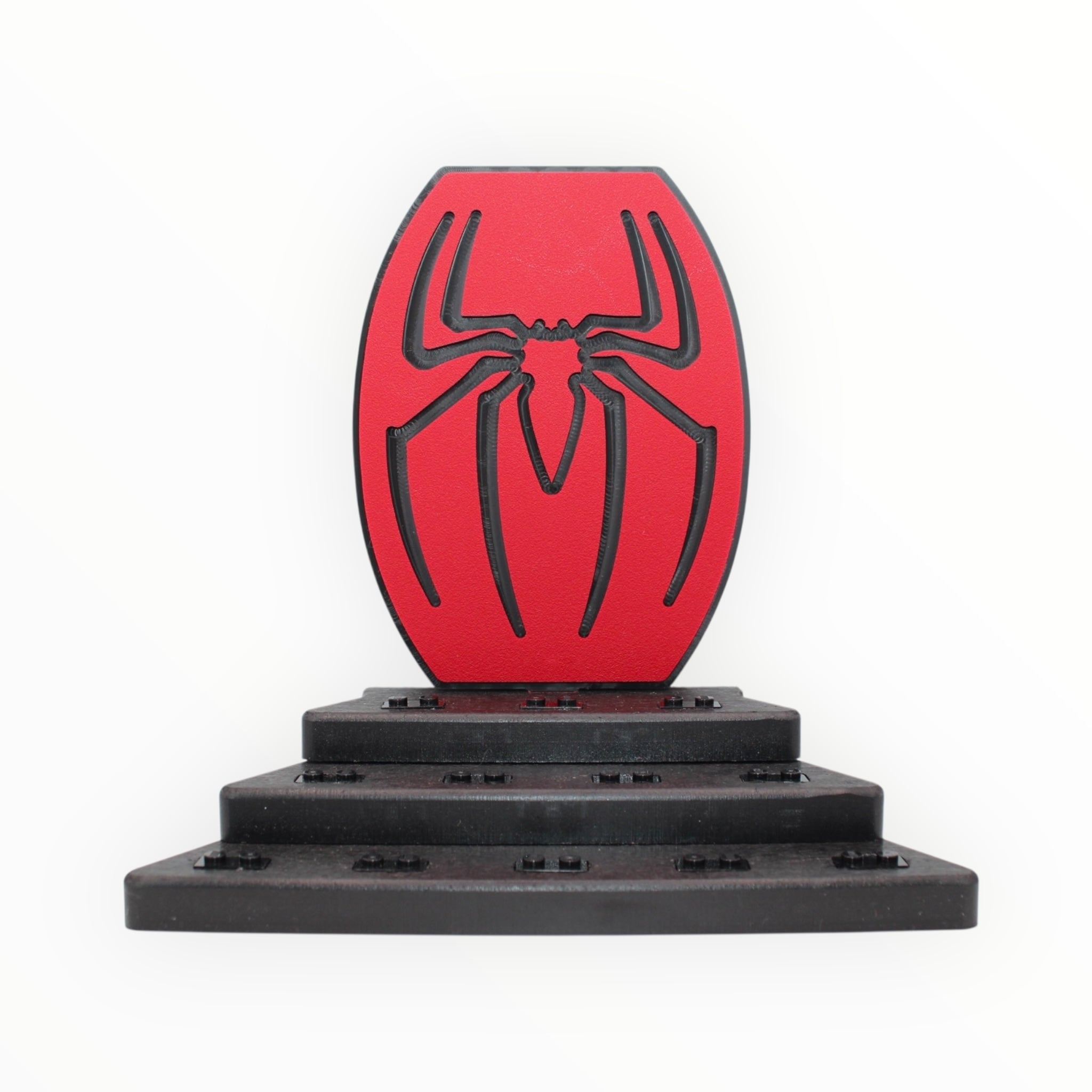 Spider-Themed Display Stand (red symbol, black studs)