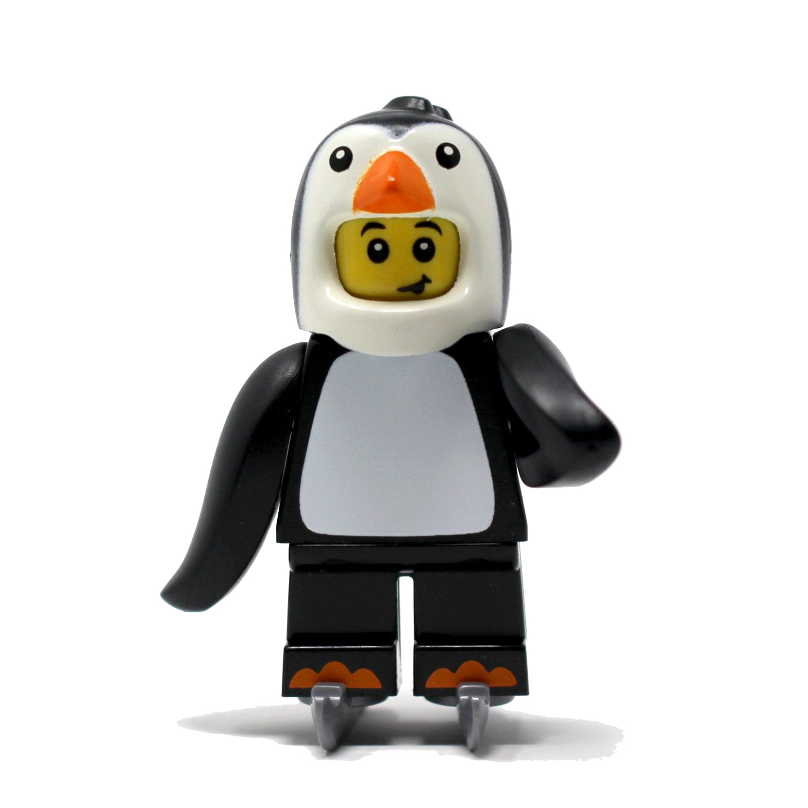 a toy penguin is sitting on a bench 