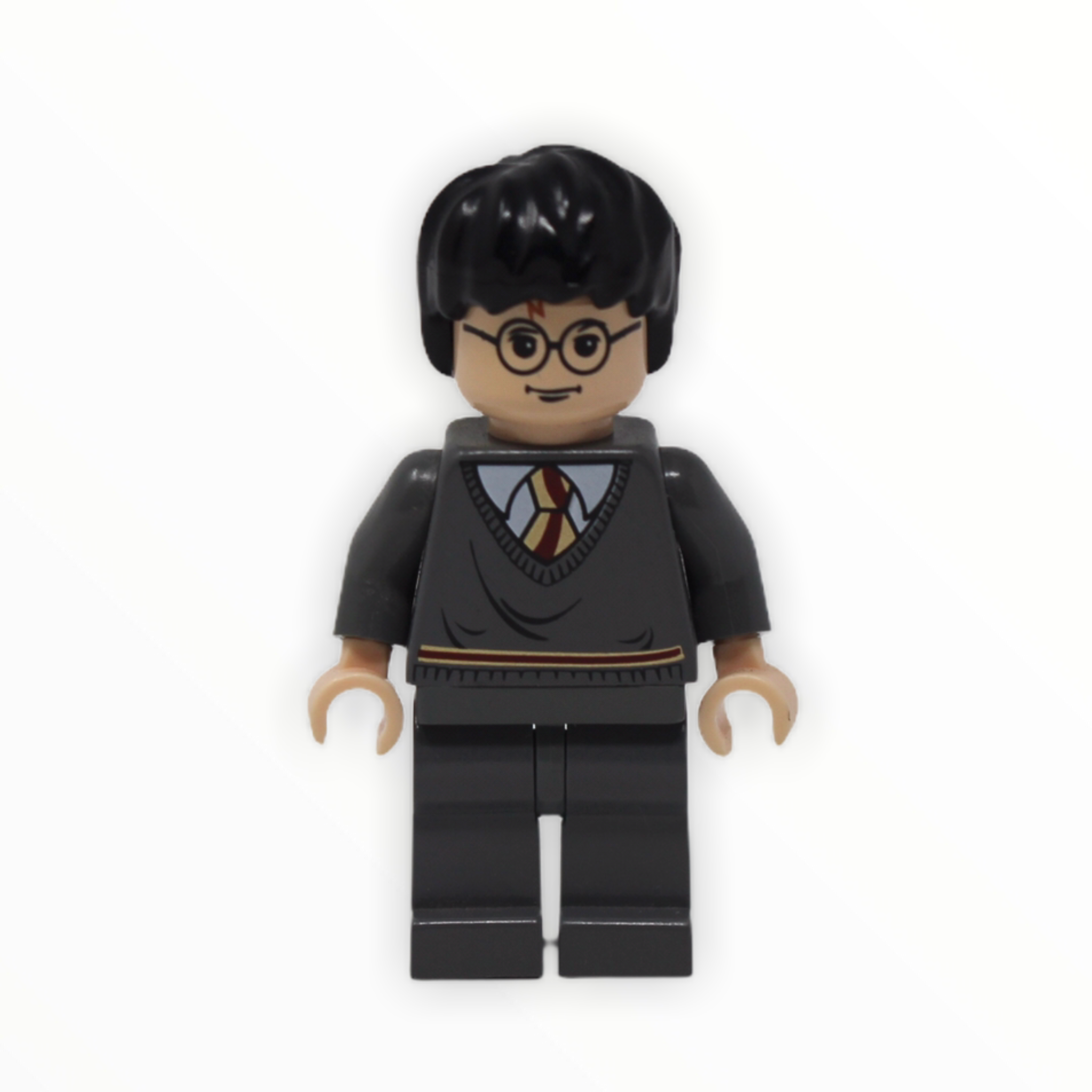 Harry Potter (Gryffindor stripe torso, dark bluish gray legs, light nougat head and hands, 2004)