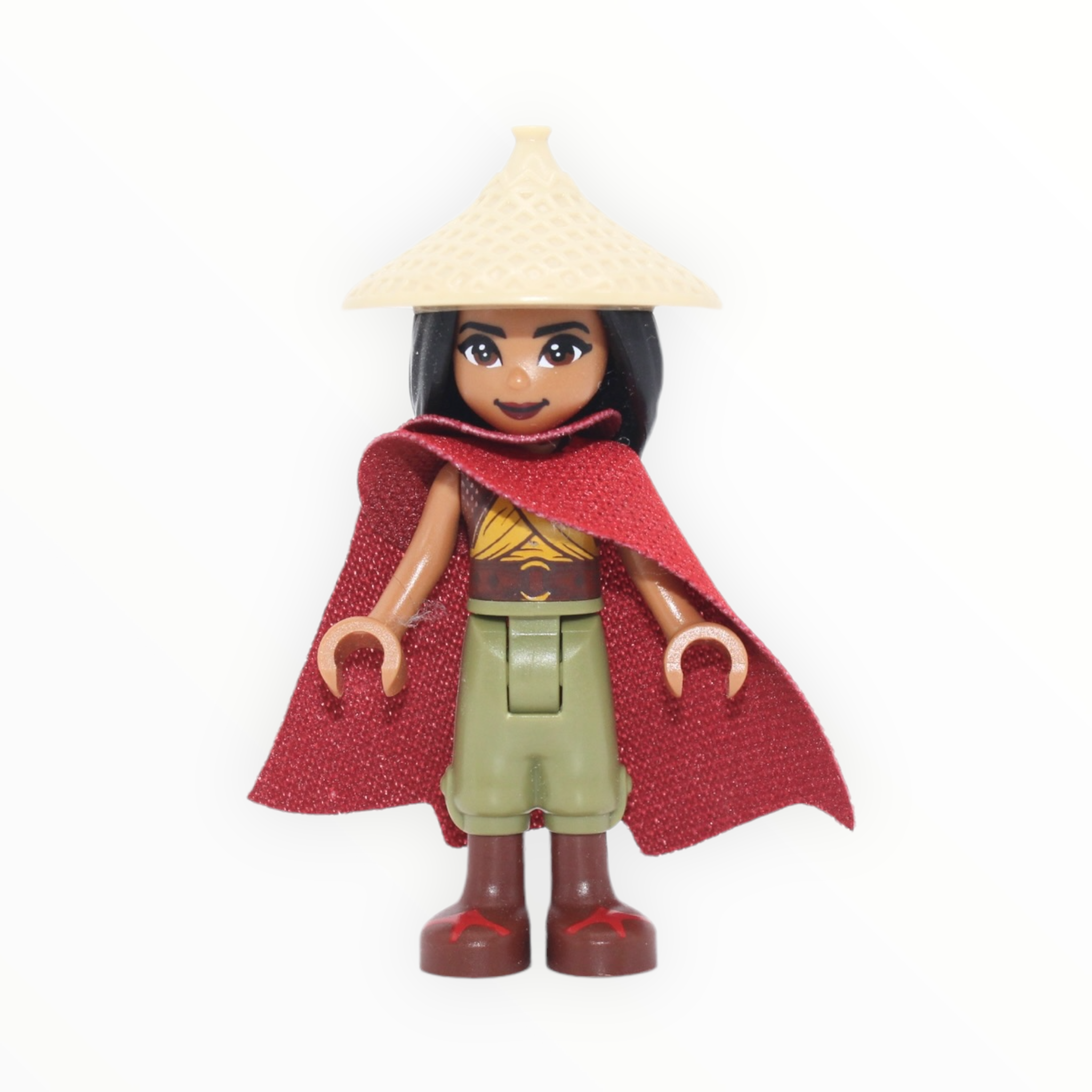 Raya (tan conical hat, red cape)